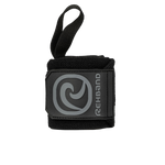 A black Rehband X-RX Wrist Wrap with a flat stitched thumb hook and logo on the strap.