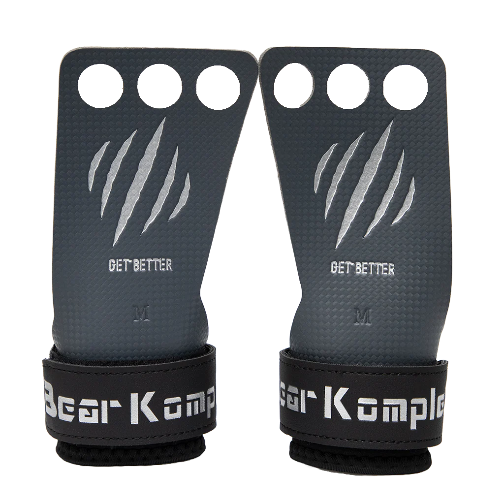 Pair of black grip gloves with 'Bear Komple' branding on a white background
