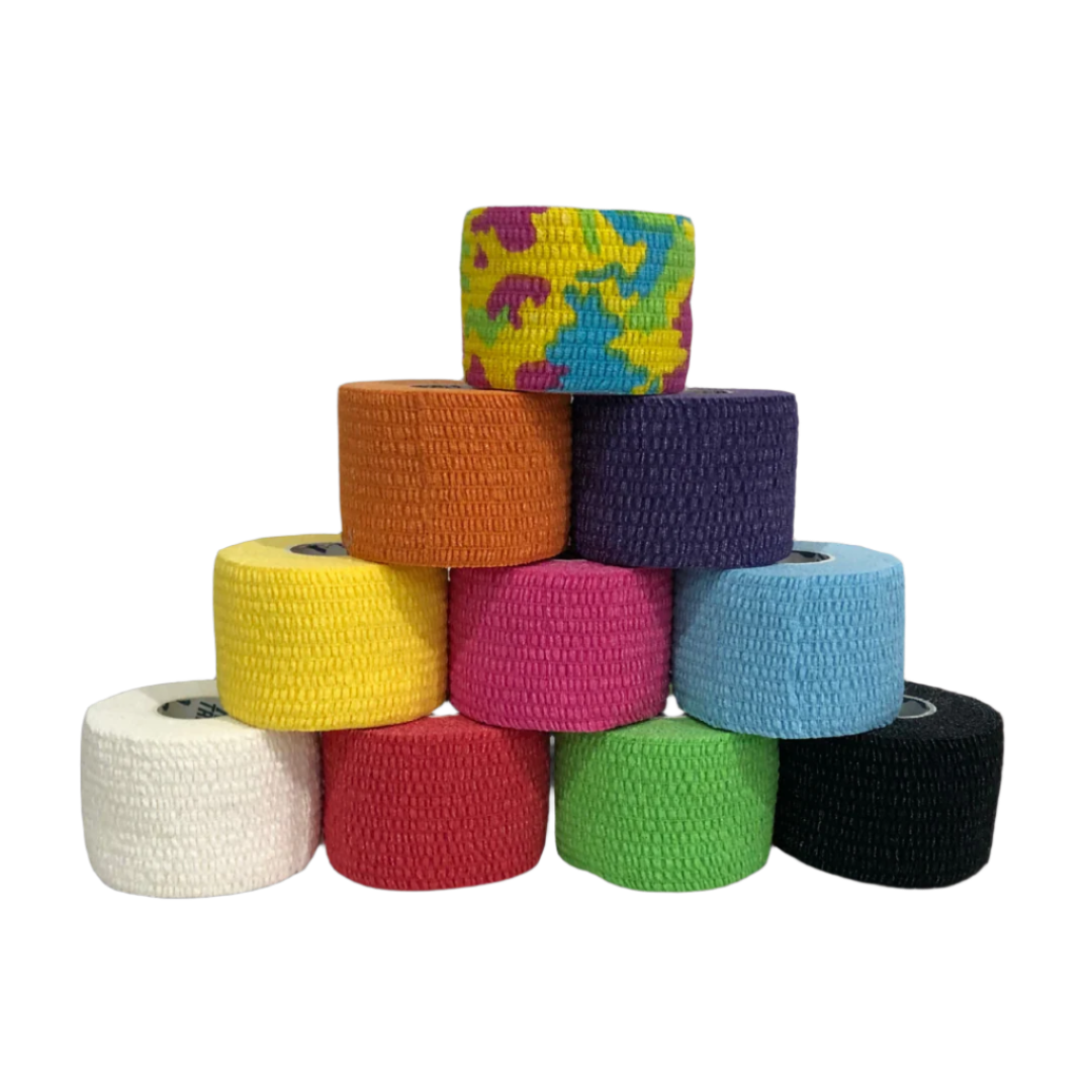 Stack of colourful frog grips tape rolls of tape on a textured dark background