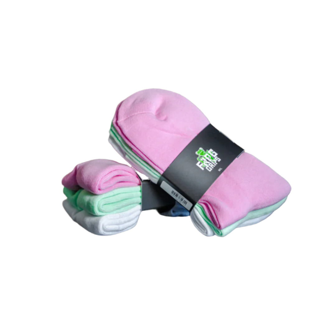 Stack of pink and white frog cross fit socks with a visible brand label on a dark surface.