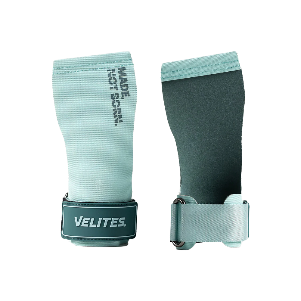 A pair of green Velites all terrain gymnastic grips with wrist bands on a white background.
