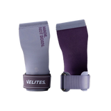 A pair of purple Velites gymnastic grips with wrist straps, displayed alongside a branded text 'NOT JUST GYMNASTICS'.