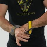 CrossFit athlete putting on Victory Grips Tactical 3.0 Freedom grips