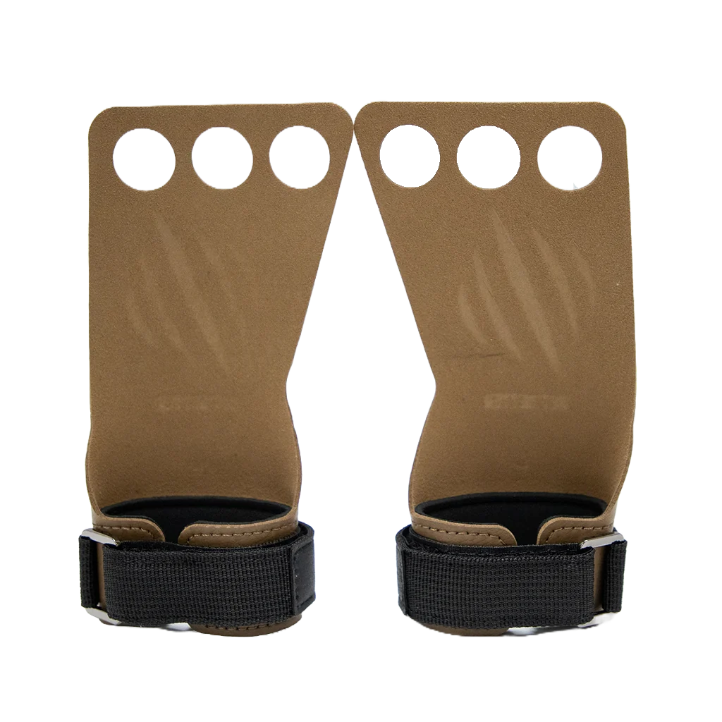 Pair of brown leather wrist straps with by bear komplex, with black buckles on a white background