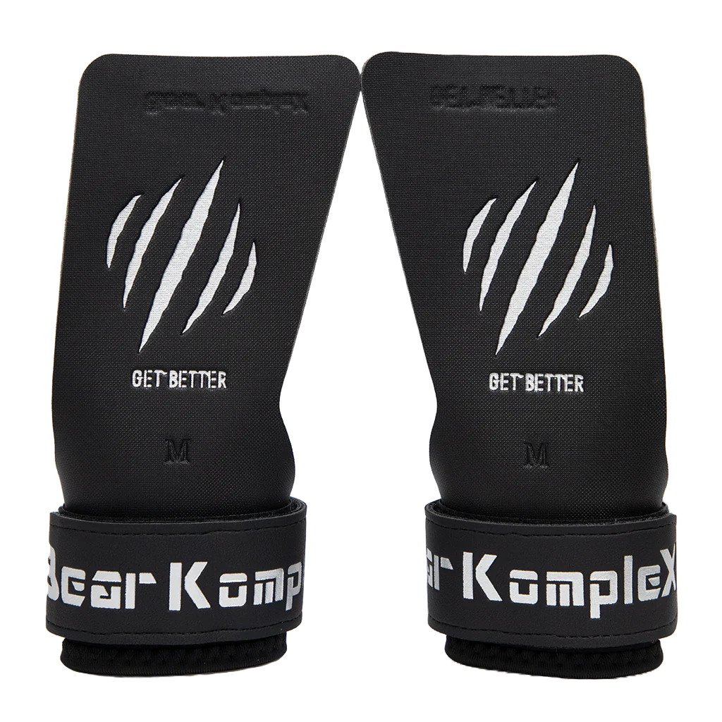 Pair of black wrist wraps with 'Bear KompleX' branding on a white background