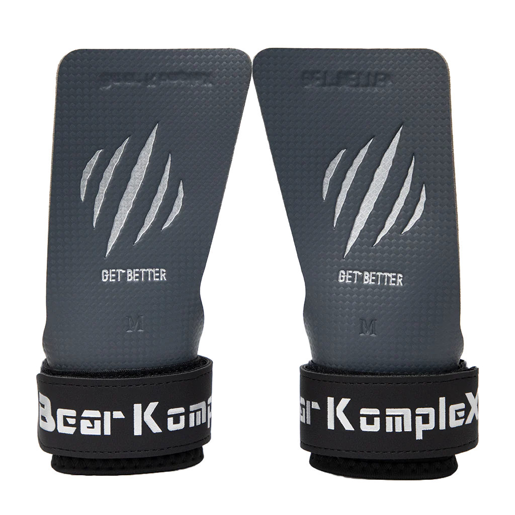 Pair of gray wrist wraps with black straps and 'Bear Komplex' branding on a white background.