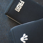 Set of Frog Grips, Elite Knee Sleeves stacked on top of one another 