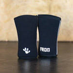 Pair of black Frog Elite Knee Sleeves standing up. 