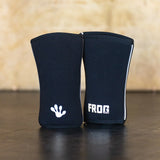 Pair of black Frog Elite Knee Sleeves standing up. 