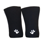 Pair of black frog grips elite knee sleeves with white frog prints on a black surface.