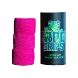 Pink lifting tape rolls with a black container labeled 'Frog Grips' on a dark surface.