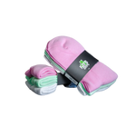 Stack of pink and white frog cross fit socks with a visible brand label on a dark surface.
