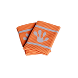 Orange frog wristbands with white handprint design on a black background