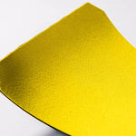 Close-up of a yellow victory hand grip on a white background