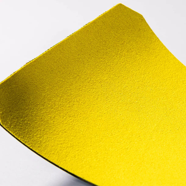 Close-up of a yellow victory hand grip on a white background