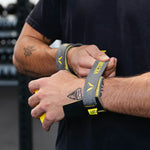 Person using hand grips with visible Victory branding in a gym setting